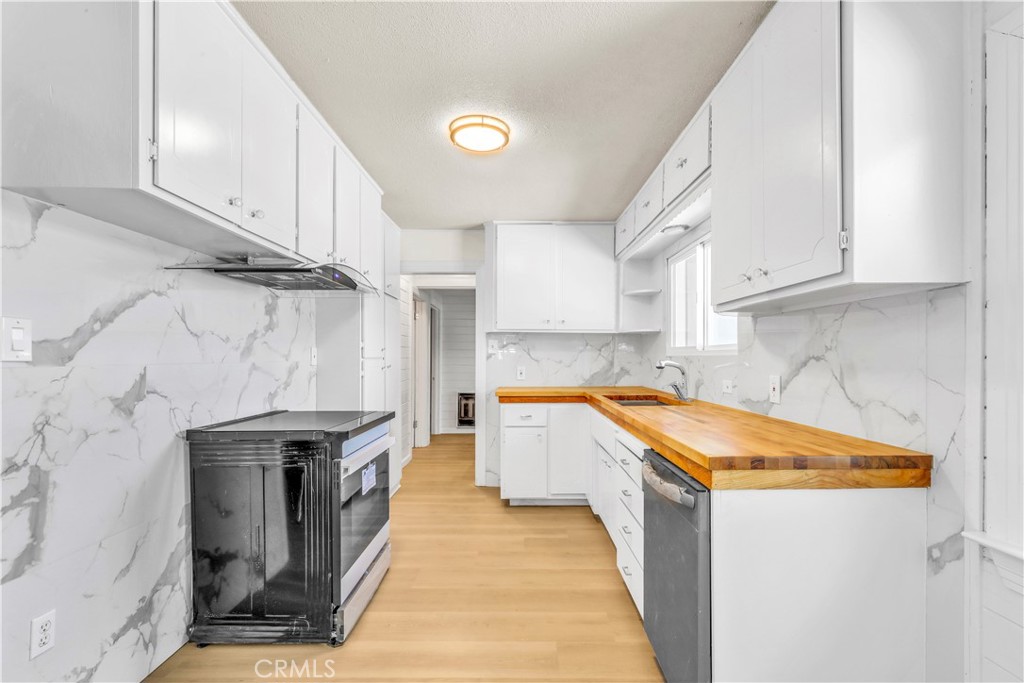 15905 Kugelman Street Lower Lake, CA 95457 - Photo 56 of 75 a kitchen with stainless steel appliances granite countertop a sink a stove and a refrigerator