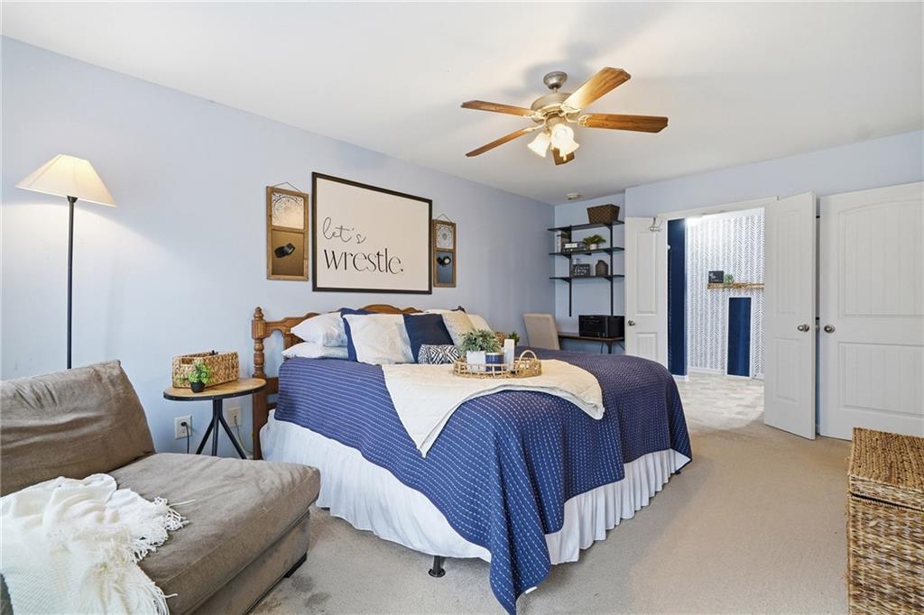 615 Myers Gate Road Ball Ground, GA 30107 - Photo 22 of 43 a bedroom with a bed and window