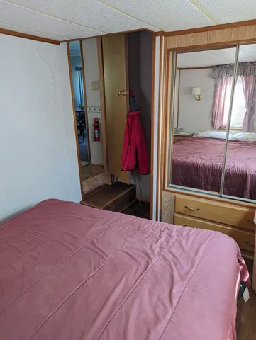 a bed room with a bed and a walk in closet