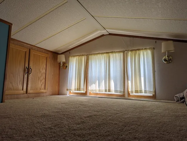 a view of a room that has a window in it