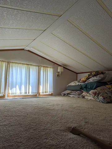 a view of a livingroom with furniture