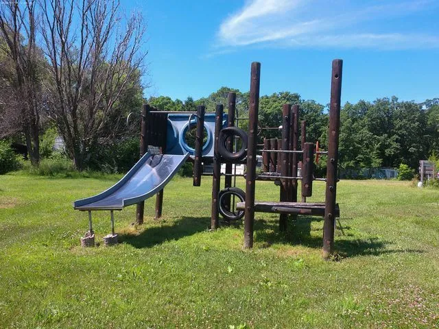 a park view with a bench sitting