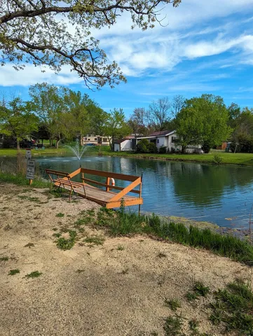 an aerial view of a house with a lake view