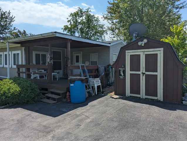 a front view of a house with patio