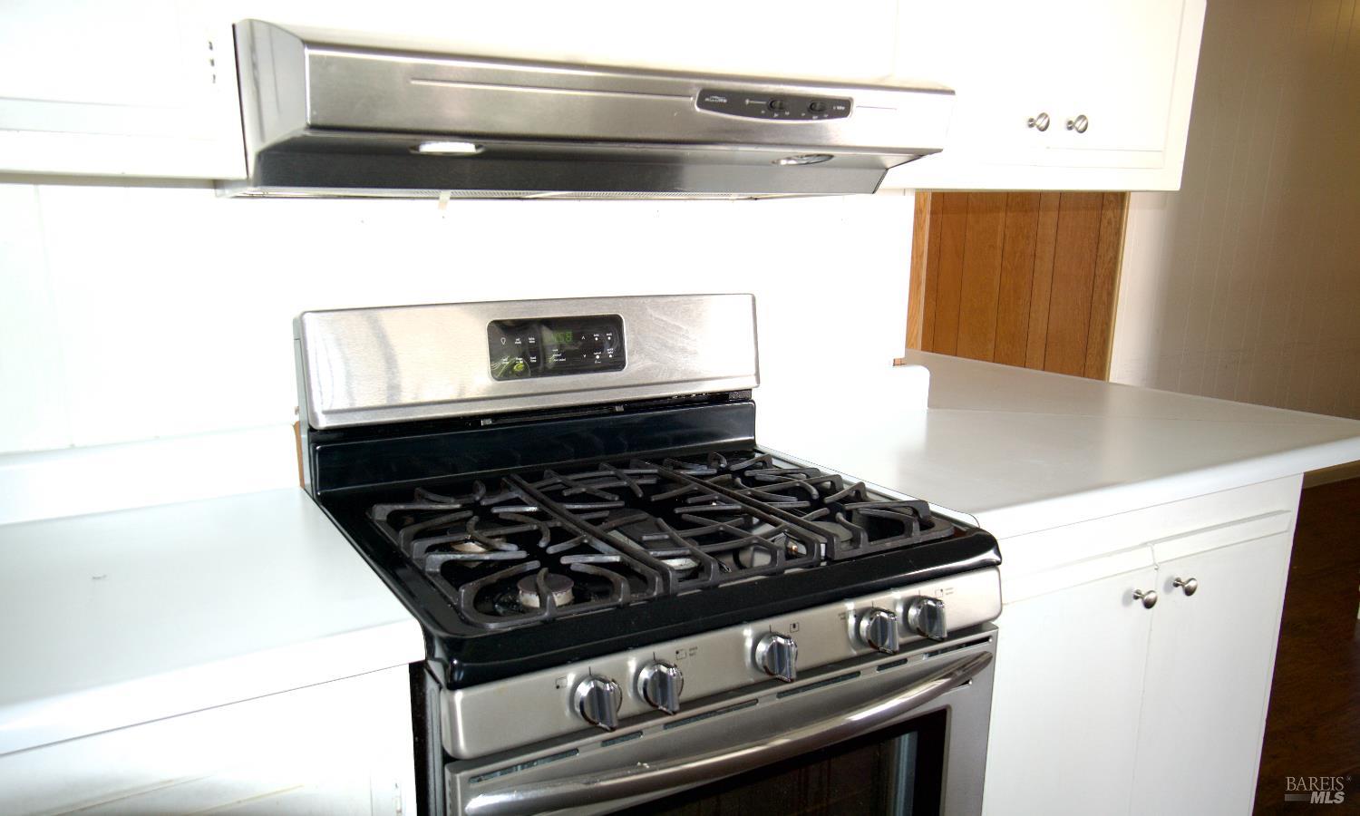 211 Colonial Park Drive Santa Rosa, CA 95403 - Photo 14 of 26 Full gas range and hood