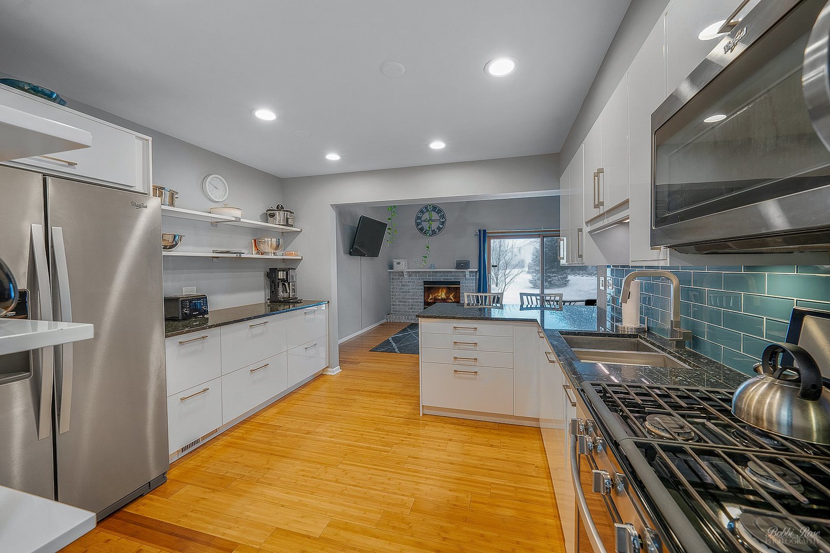 834 Golf Course Road Crystal Lake, IL 60014 - Photo 16 of 40 a large kitchen with stainless steel appliances granite countertop a stove and a sink