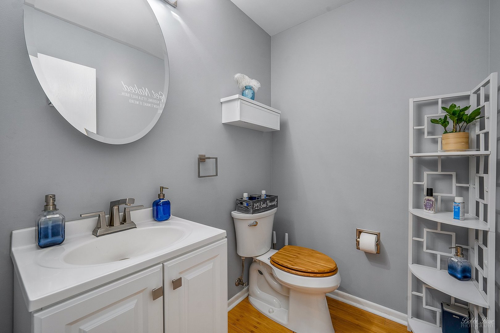 834 Golf Course Road Crystal Lake, IL 60014 - Photo 18 of 40 a bathroom with a sink a toilet and a mirror