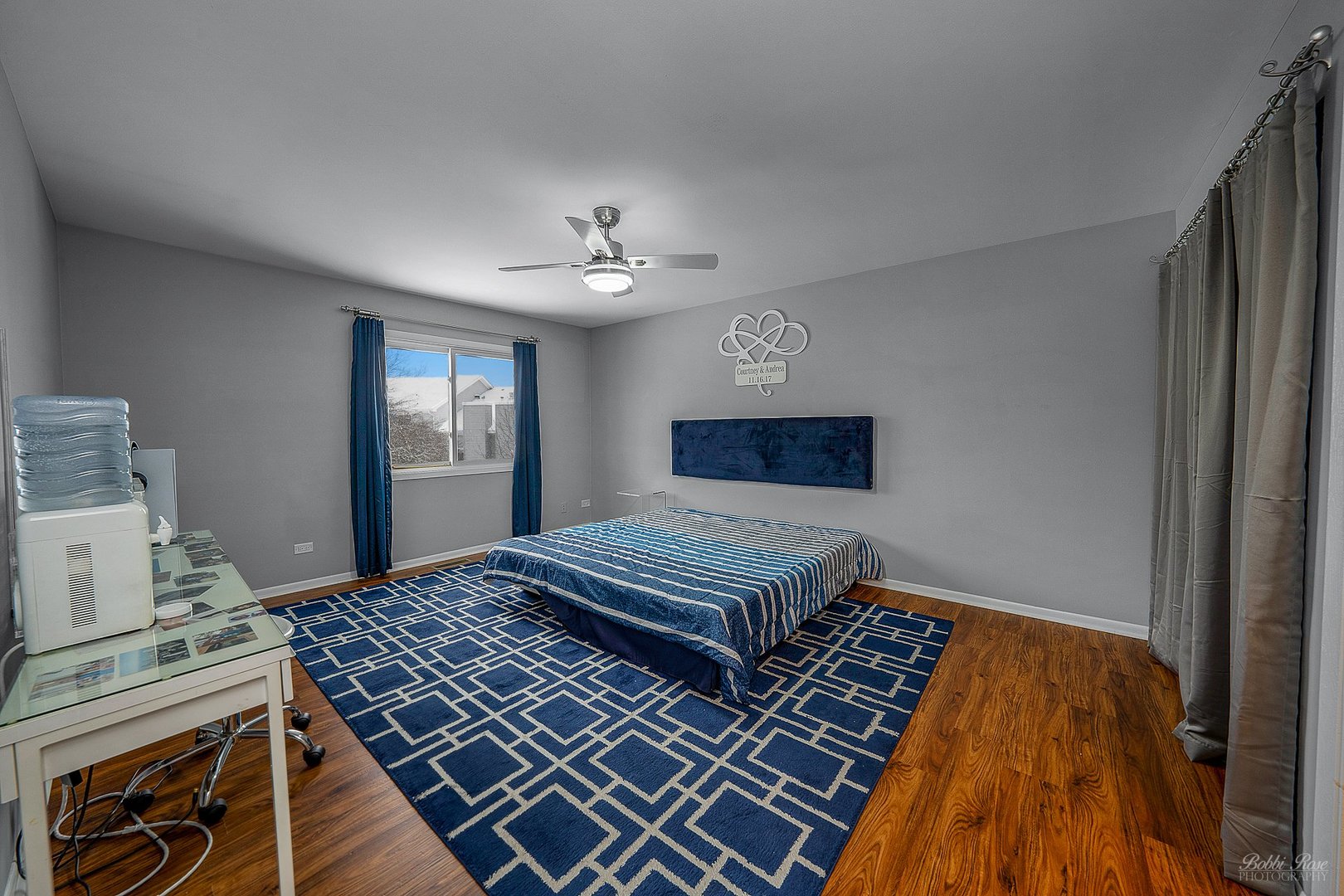 834 Golf Course Road Crystal Lake, IL 60014 - Photo 22 of 40 a bedroom with a bed and wooden floor