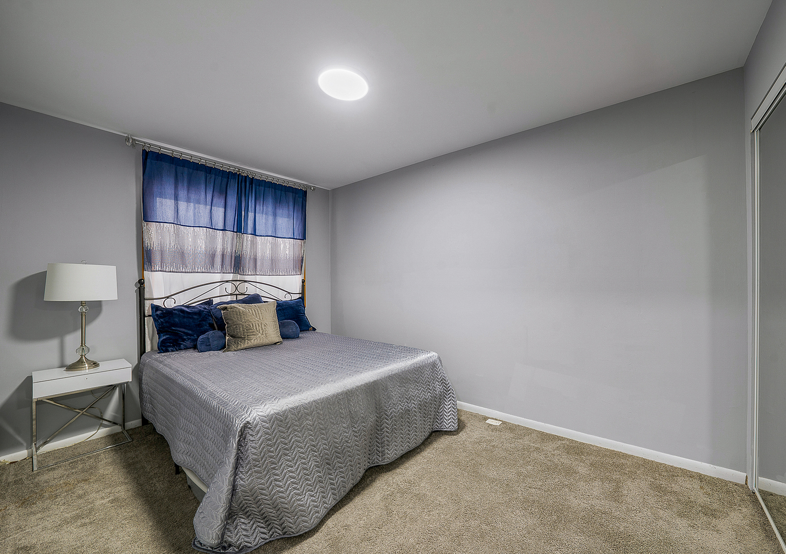 834 Golf Course Road Crystal Lake, IL 60014 - Photo 24 of 40 a bedroom with a bed and a lamp with the table