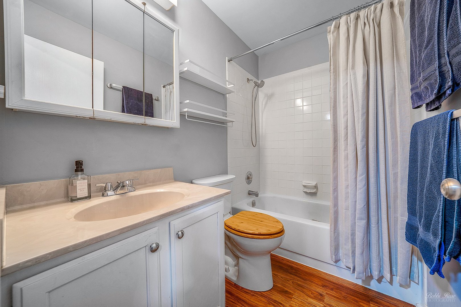 834 Golf Course Road Crystal Lake, IL 60014 - Photo 26 of 40 a bathroom with a sink toilet and shower