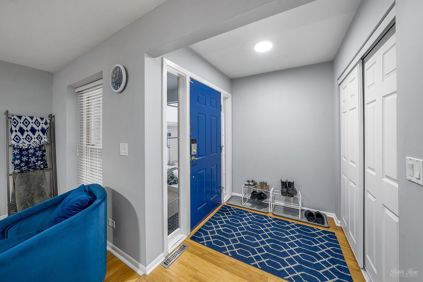 834 Golf Course Road Crystal Lake, IL 60014 - Photo 5 of 40 a view of a hallway with wooden floor and cabinet