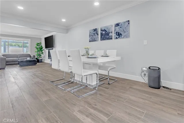 a view of a work space with wooden floor and furniture