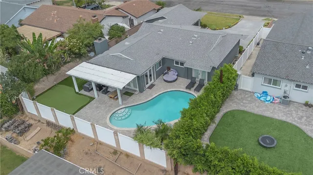an aerial view of a house with a garden