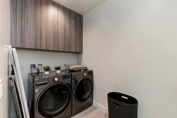 a view of storage and utility room with washer and dryer