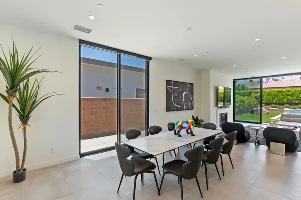 a view of a dining room with furniture window and outside view