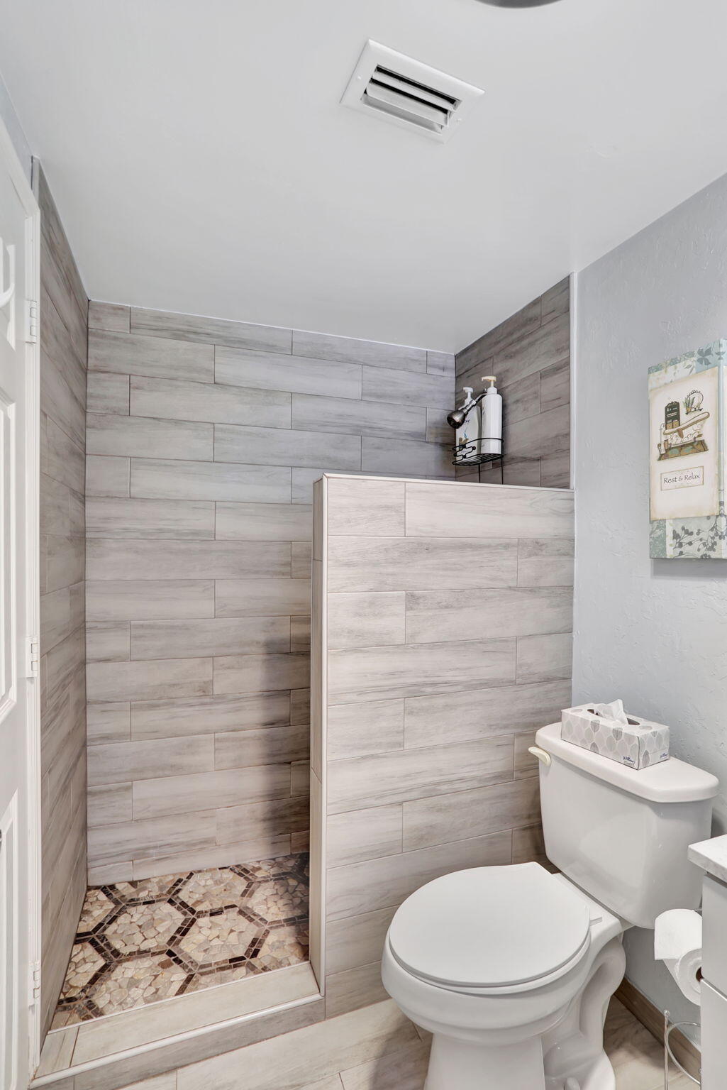 999 North Riverside Drive, Unit 3 Pompano Beach, FL 33062 - Photo 11 of 15 a bathroom with a toilet and a shower