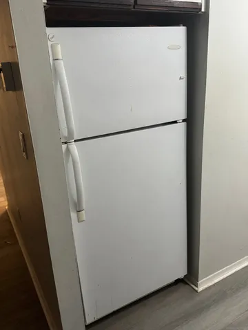 a close view of a closet with wooden floor