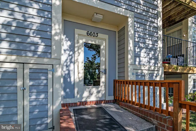 a front view of a house with a glass door