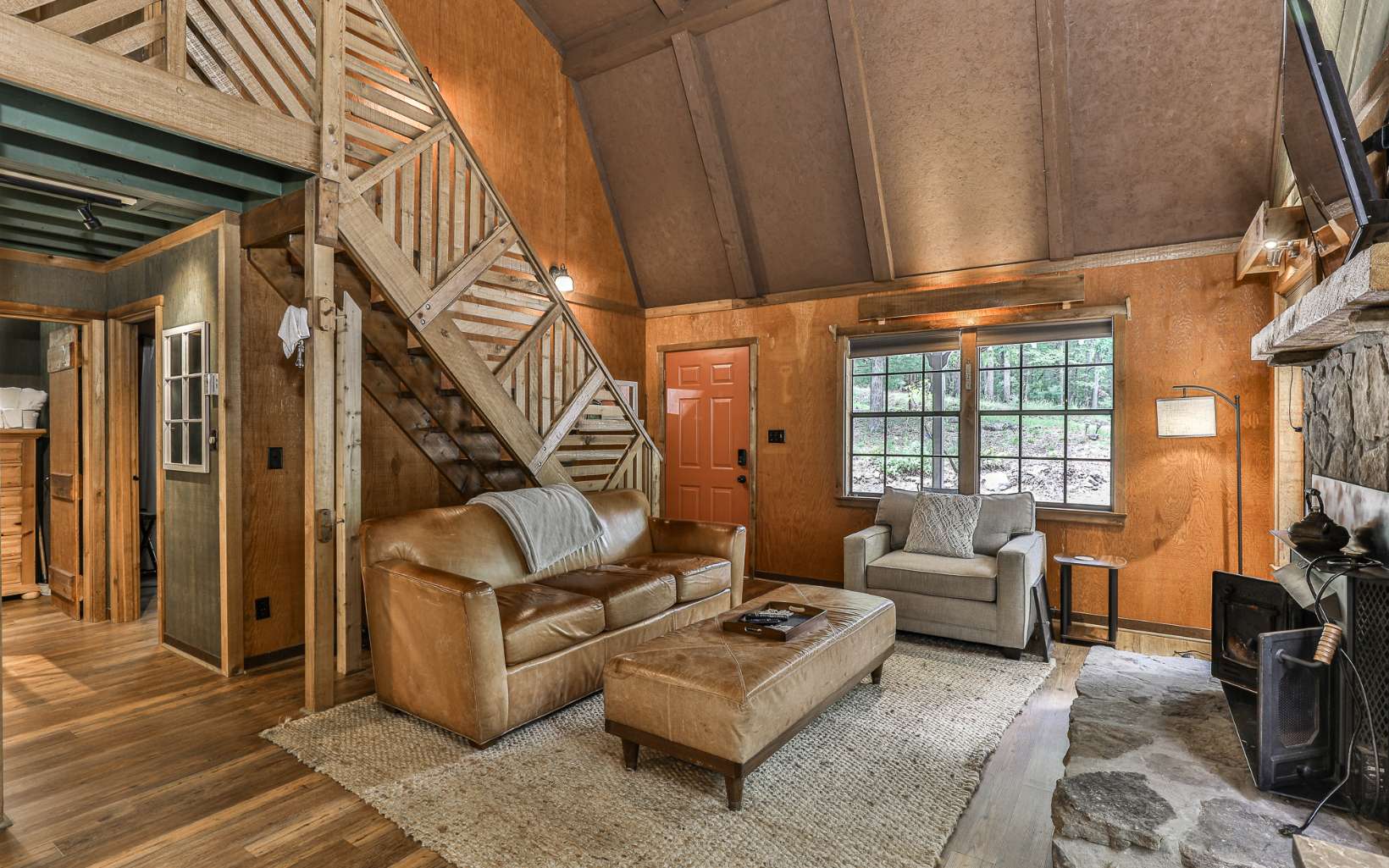 241 Walnut Mountain Road Ellijay, GA 30536 - Photo 11 of 34 a living room with furniture or couch and a potted plant