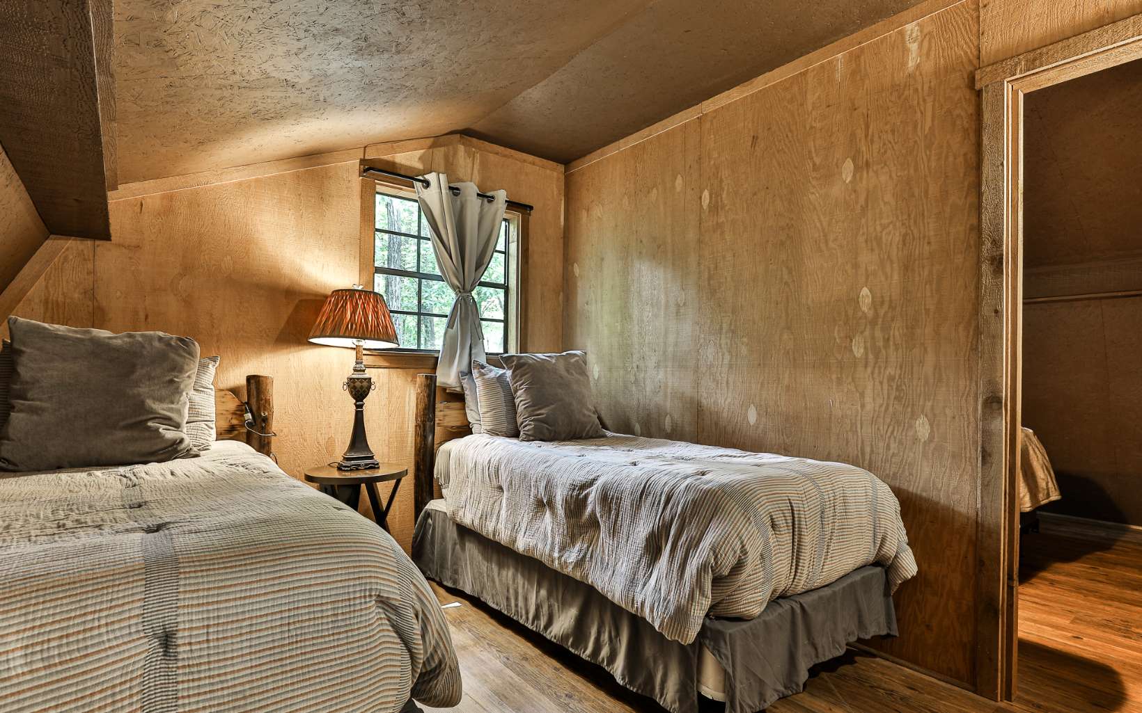 241 Walnut Mountain Road Ellijay, GA 30536 - Photo 23 of 34 a bedroom with two beds and a window