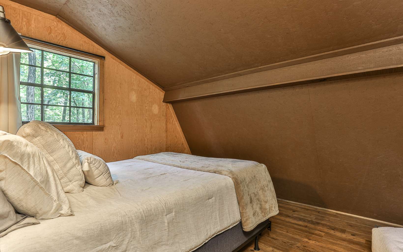 241 Walnut Mountain Road Ellijay, GA 30536 - Photo 24 of 34 a bedroom with a bed and a window
