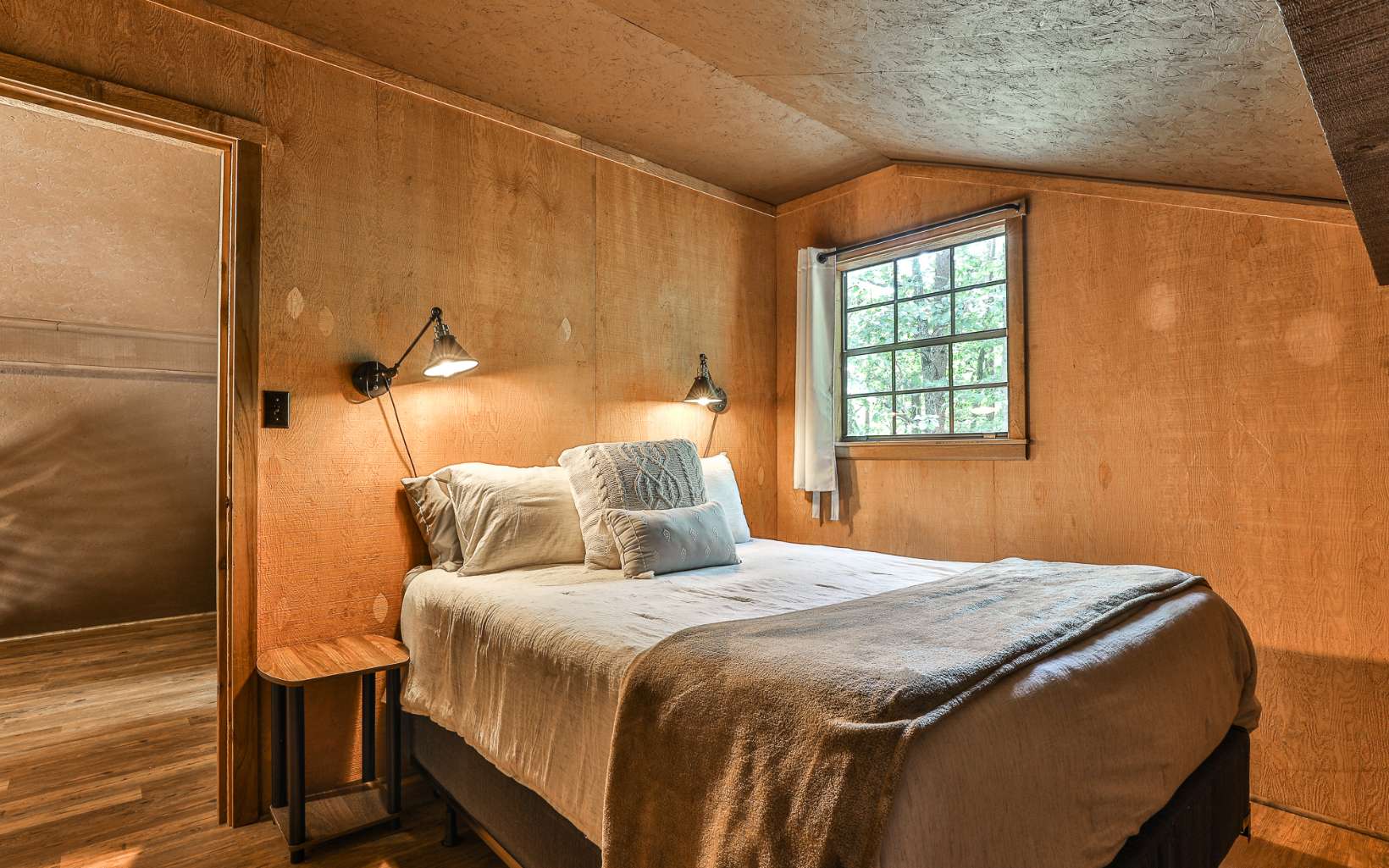 241 Walnut Mountain Road Ellijay, GA 30536 - Photo 25 of 34 a bedroom with a bed and a window