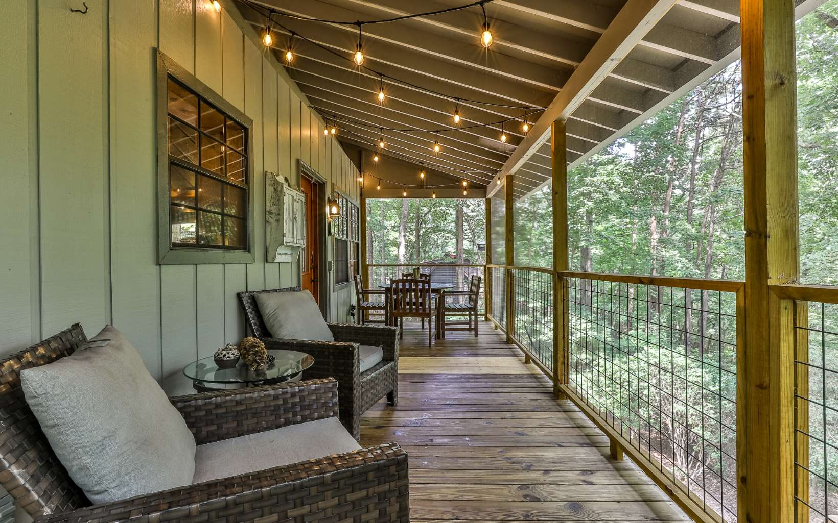 241 Walnut Mountain Road Ellijay, GA 30536 - Photo 27 of 34 a living room with furniture and wooden floor