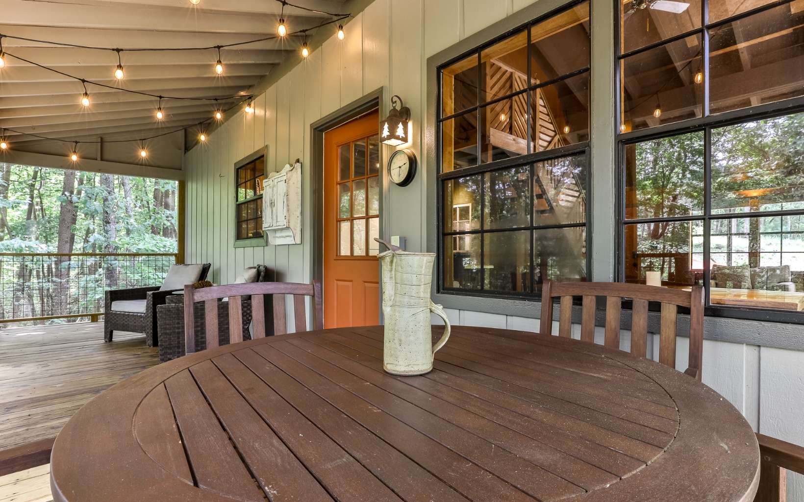 241 Walnut Mountain Road Ellijay, GA 30536 - Photo 28 of 34 a dining room with wooden floor glass table and chairs