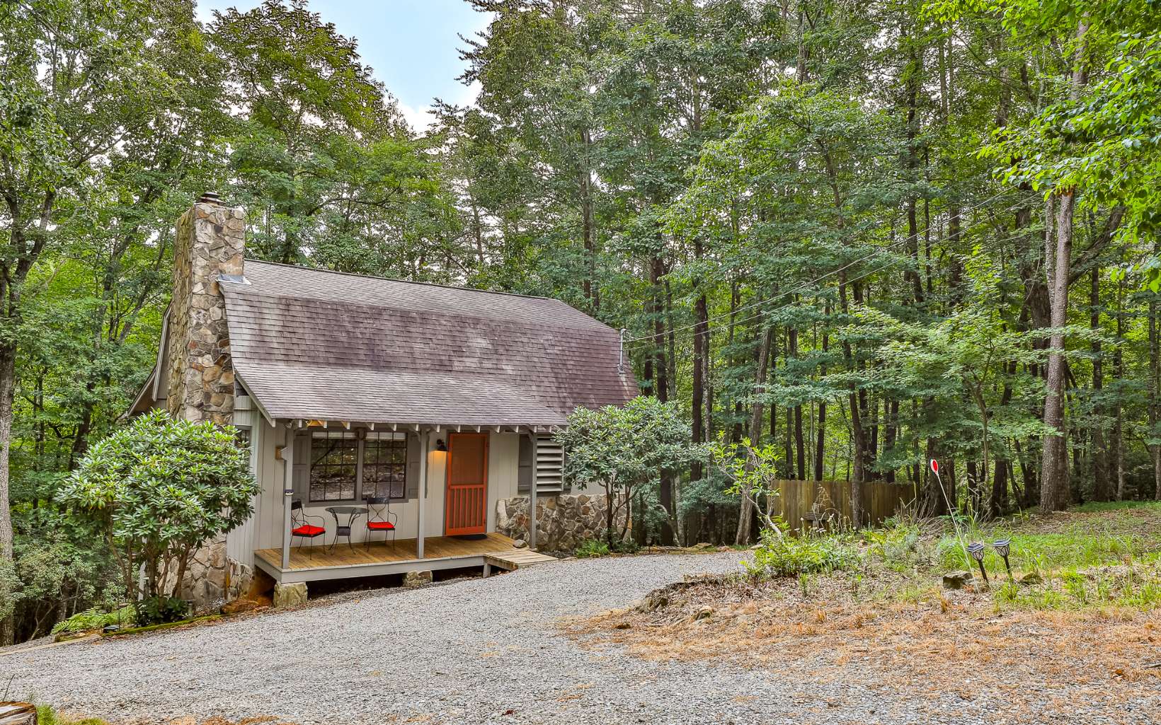 241 Walnut Mountain Road Ellijay, GA 30536 - Photo 29 of 34 a view of a house with a patio and a yard