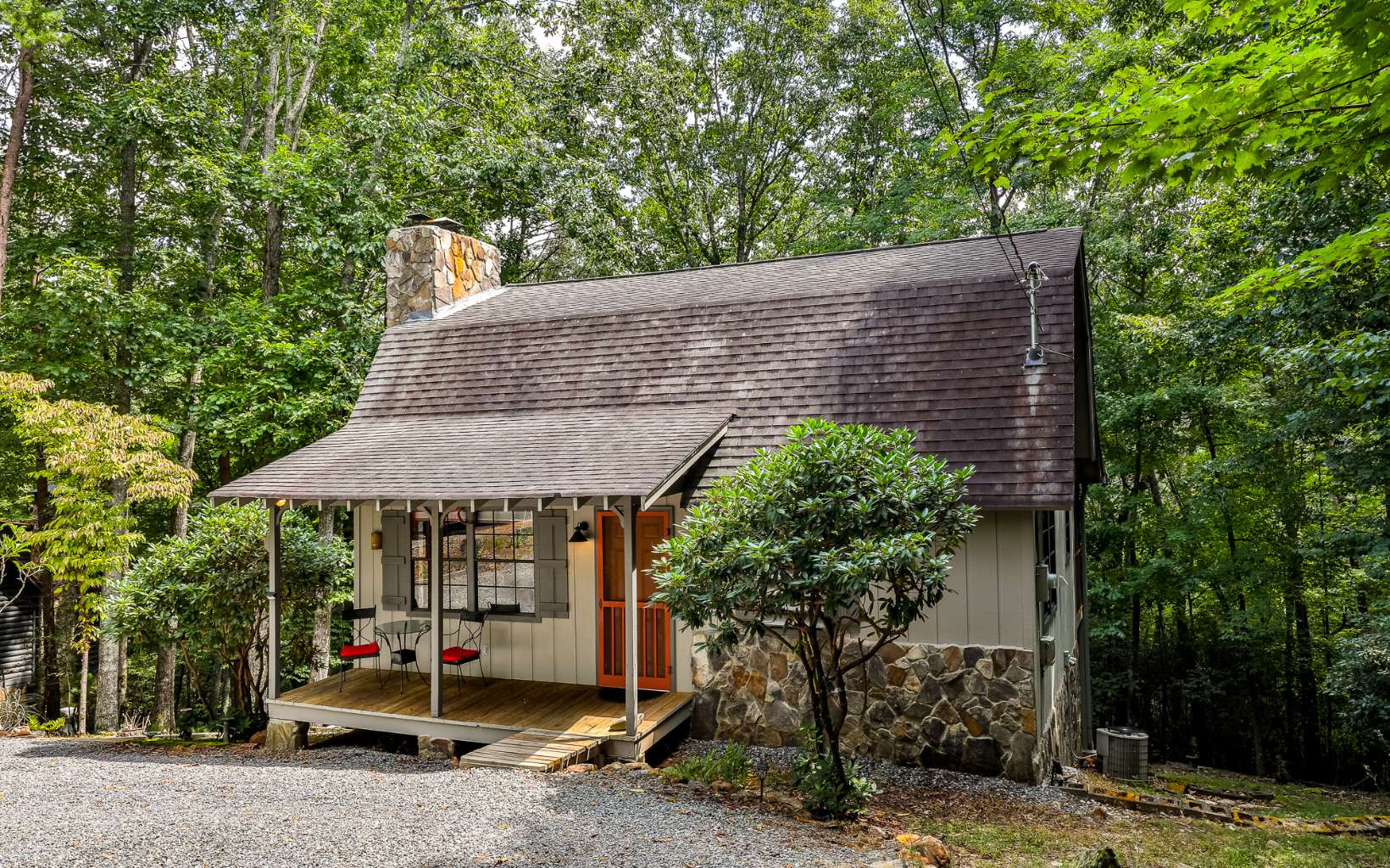 241 Walnut Mountain Road Ellijay, GA 30536 - Photo 6 of 34 a backyard of a house with barbeque oven and palm trees