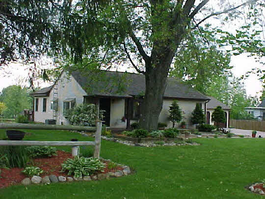 7245 Middle Road South Beloit, IL 61080 - Photo 1 of 1 a front view of a house with a yard and porch