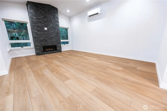 a view of an empty room with a fireplace