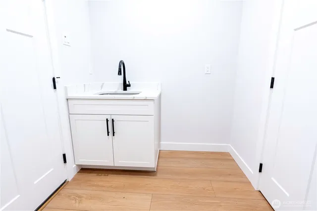 a bathroom with a sink and mirror