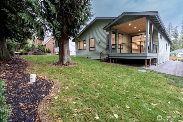 a front view of house with yard and porch