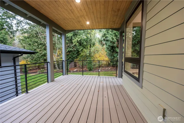 a view of balcony with wooden floor