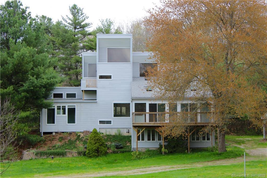 a aerial view of a house with a yard