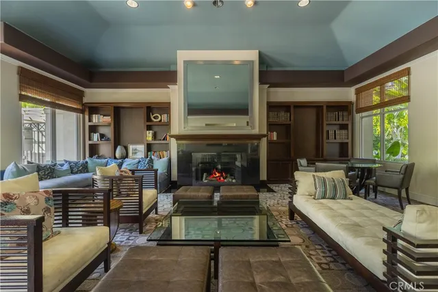 a living room with furniture fireplace and window