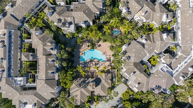an aerial view of residential house with outdoor space and parking