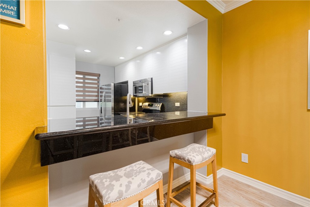 2233 Martin, Unit 108 Irvine, CA 92612 - Photo 8 of 34 a kitchen with a sink counter top space and appliances
