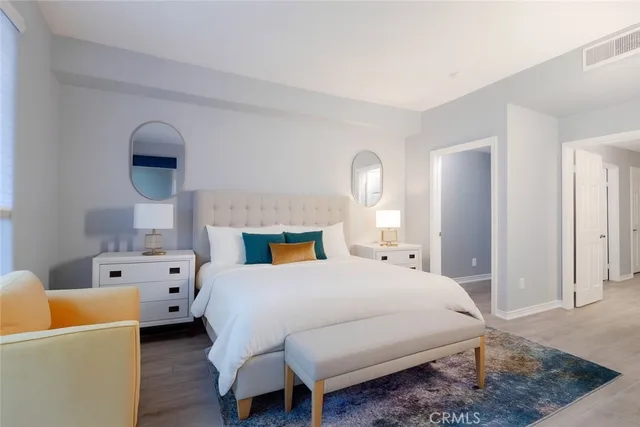 a bedroom with a bed and a couch