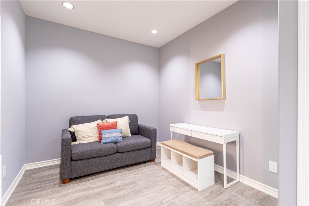 2233 Martin, Unit 108 Irvine, CA 92612 - Photo 10 of 34 a living room with furniture and a wooden floor
