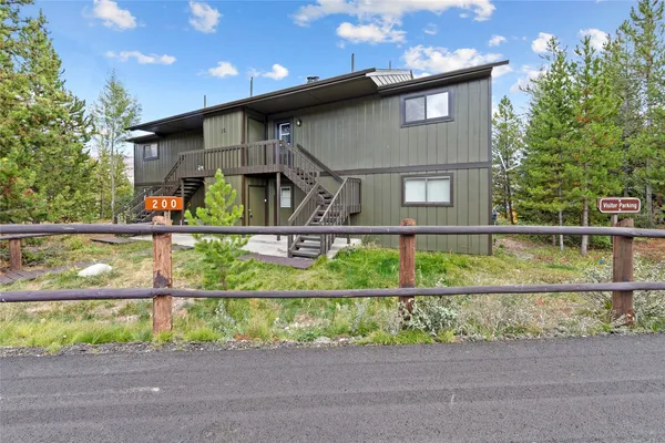 a front view of a house with a fence