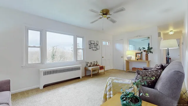 a living room with furniture and a window