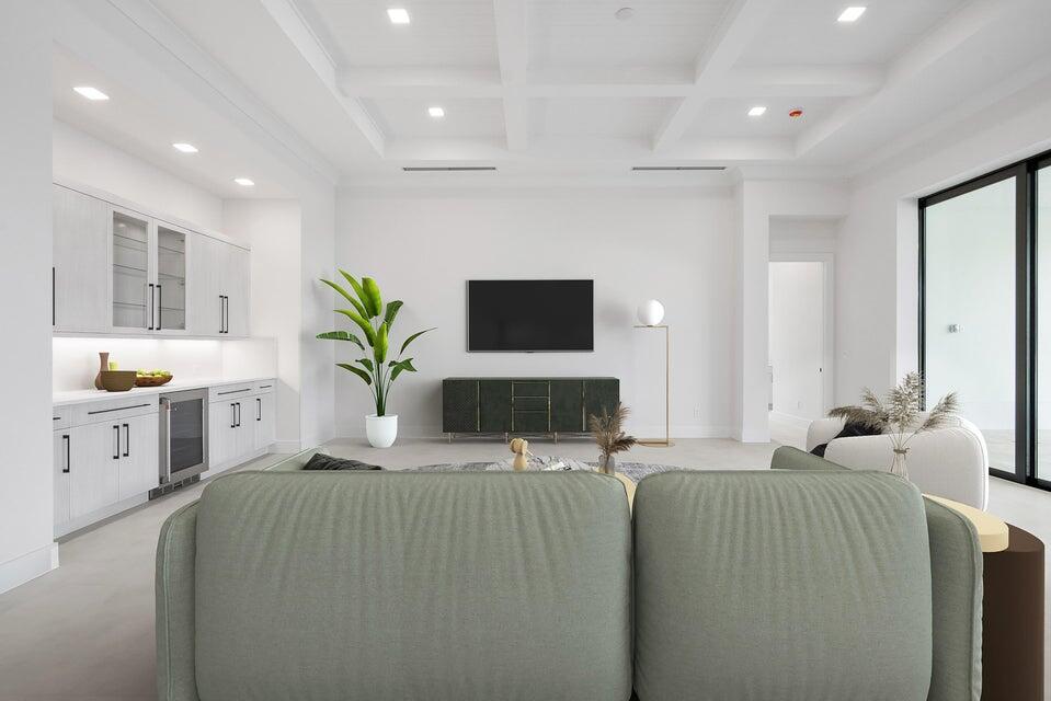 170 Southeast Rio Angelica Port St. Lucie, FL 34984 - Photo 14 of 55 a living room with kitchen island furniture and flat screen tv