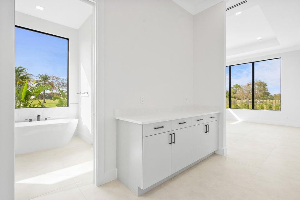 170 Southeast Rio Angelica Port St. Lucie, FL 34984 - Photo 29 of 55 a spacious bathroom with a bathtub and a shower
