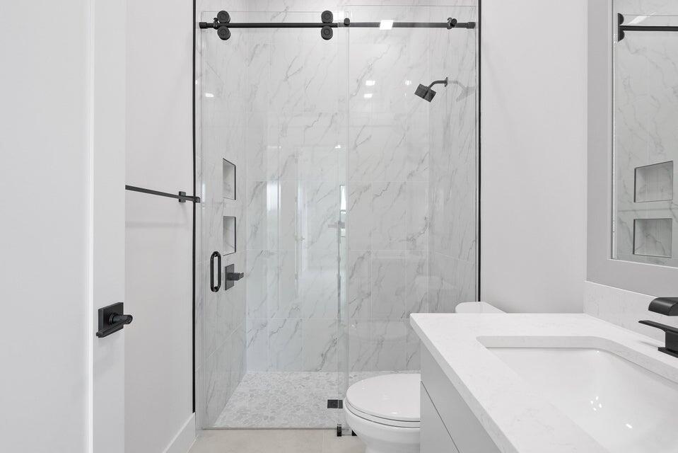 170 Southeast Rio Angelica Port St. Lucie, FL 34984 - Photo 42 of 55 a bathroom with a sink toilet and shower