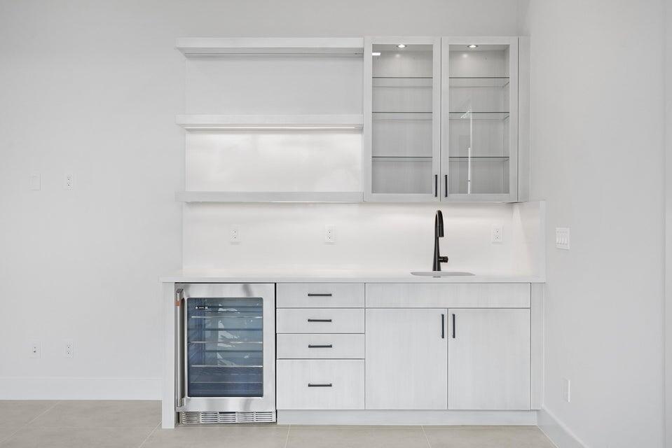 170 Southeast Rio Angelica Port St. Lucie, FL 34984 - Photo 45 of 55 a view of a kitchen with white cabinets