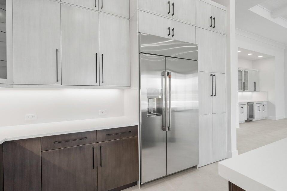 170 Southeast Rio Angelica Port St. Lucie, FL 34984 - Photo 8 of 55 a kitchen with stainless steel appliances a refrigerator and cabinets