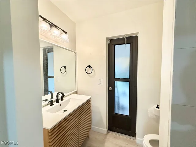 a bathroom with a sink and mirror