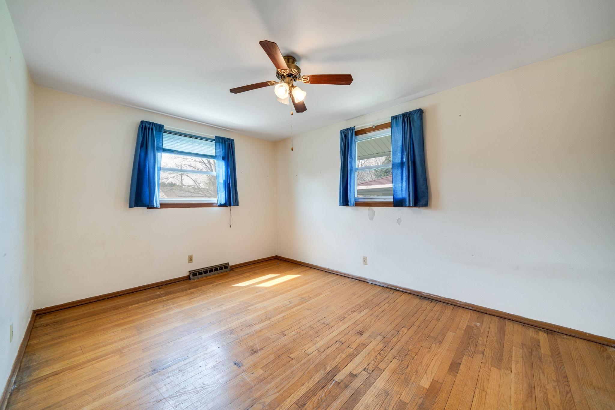 1611 Notre Dame Road Rockford, IL 61103 - Photo 14 of 33 a view of an empty room with wooden floor and a window